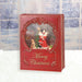 LED glitter book decoration showing Santa dancing in swirling snow

