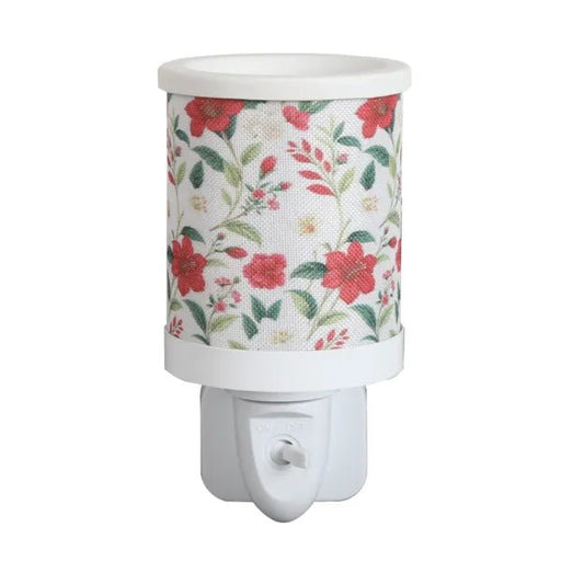 Red floral plug in wax melt burner with a wraparound botanical pattern and an on/off switch on the plug base.