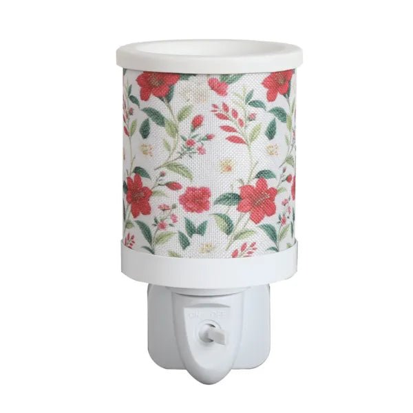 Red floral plug in wax melt burner with a wraparound botanical pattern and an on/off switch on the plug base.