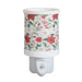 Red floral plug in wax melt burner with a wraparound botanical pattern and an on/off switch on the plug base.