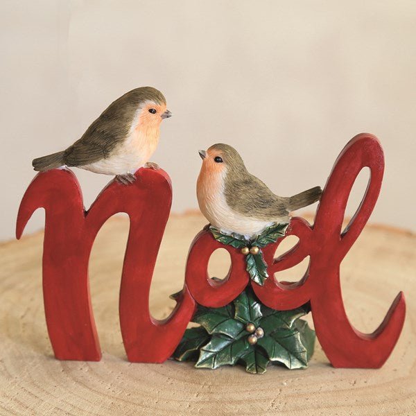Freestanding Noel sign decorated with robins and gold berries

