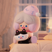 RiCO & Kancho’s Bed Time figure on cosy bed with black-and-white cat
