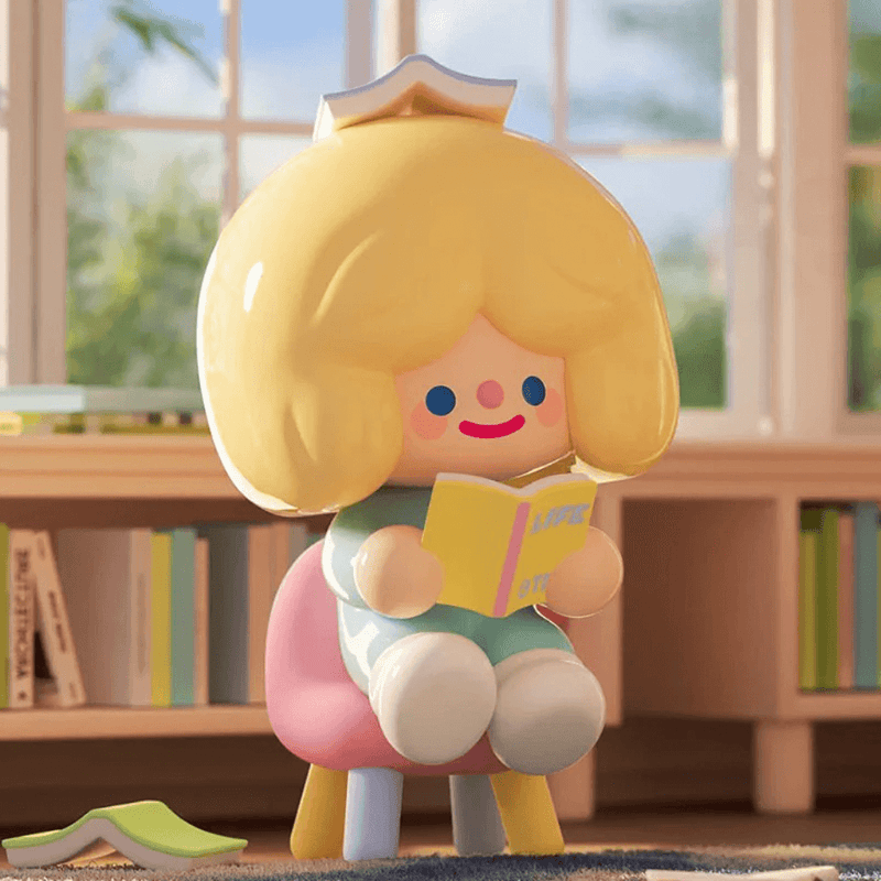 RiCO’s Reading Time figure on pink chair, book balanced atop head

