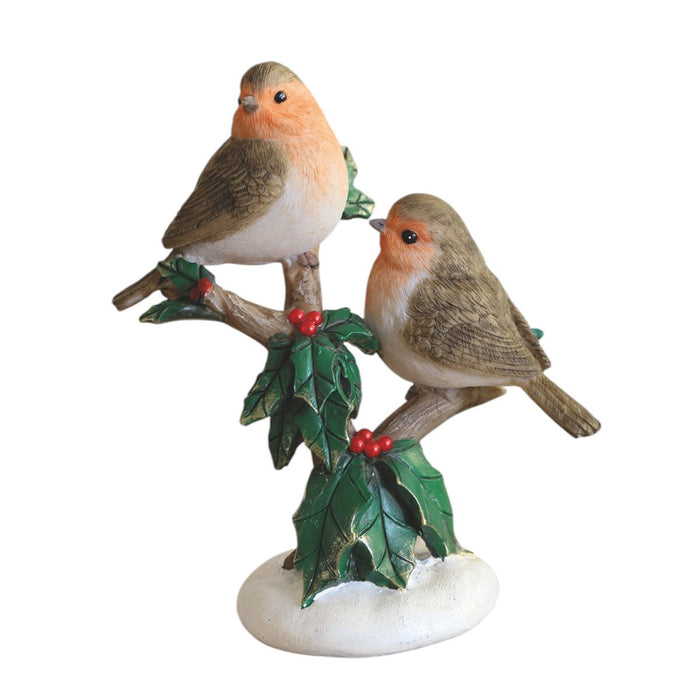 Two robins on a holly branch with red berries on a snowy base, 13cm ornament.

