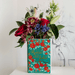 Romeo and Juliet ceramic book vase used as a decorative flower arrangement