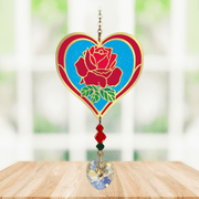 Heart-shaped Rose Crystal Suncatcher with deep red rose motif and faceted prism heart catching sunlight
