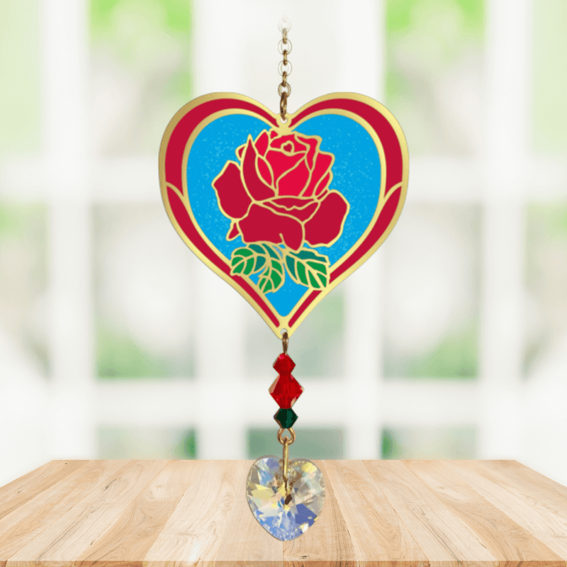 Heart-shaped Rose Crystal Suncatcher with deep red rose motif and faceted prism heart catching sunlight
