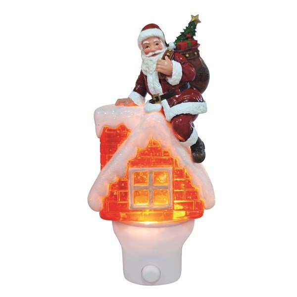18cm plug-in night light shaped like a snowy house with Santa on the roof, warm LED glow and glitter spinner.