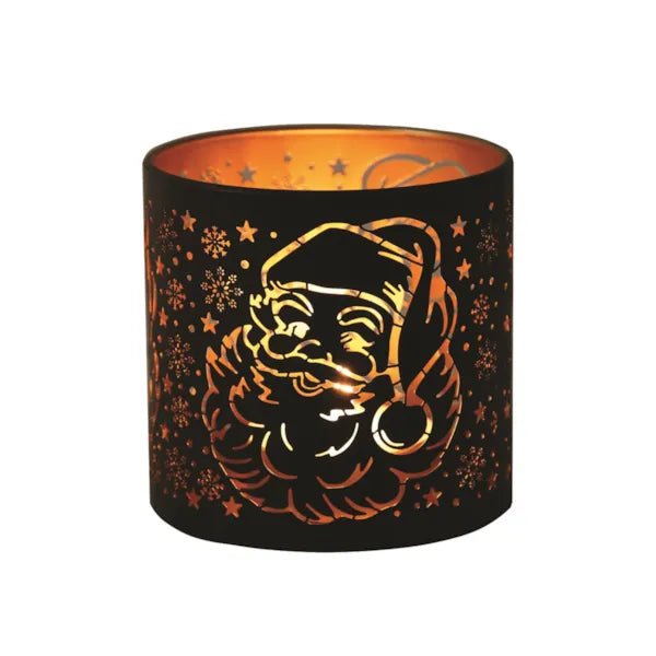 Round black and gold Santa silhouette tealight candle holder shown glowing