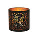 Round black and gold Santa silhouette tealight candle holder shown glowing