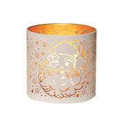 Round white and gold Santa silhouette tealight candle holder shown glowing