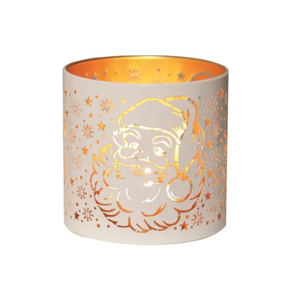 Round white and gold Santa silhouette tealight candle holder shown glowing