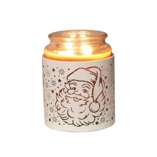 White Santa silhouette sleeve used as a candle jar holder with lit jar inside