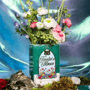 Spring Court book vase filled with flowers in a fantasy-inspired display