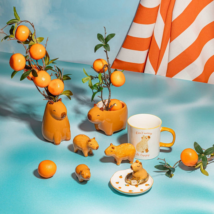 Sass & Belle Capybara salt and pepper shakers in a playful tabletop lifestyle scene
