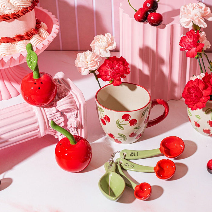 Cherry measuring spoons by Sass & Belle displayed with cherry mugs and flowers