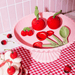 Sass and Belle cherry pocket token styled with cherry kitchen accessories, measuring spoons and salt and pepper shakers