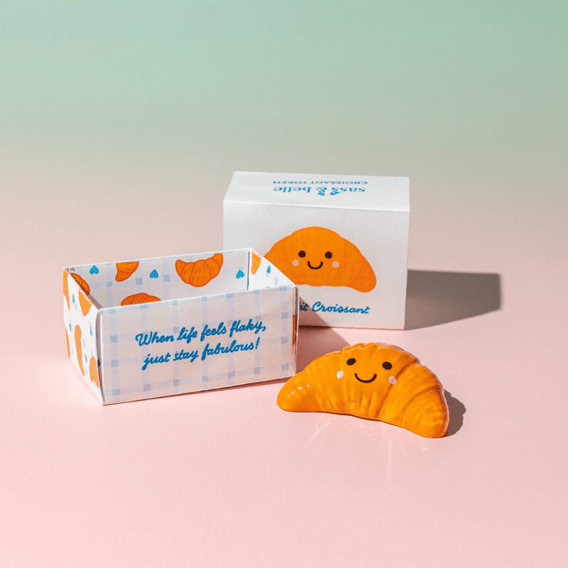 Sass & Belle croissant pocket token with gift box packaging and quote When life feels flaky just stay fabulous