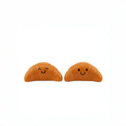 Sass & Belle Croissant salt and pepper shakers, front view with smiling faces