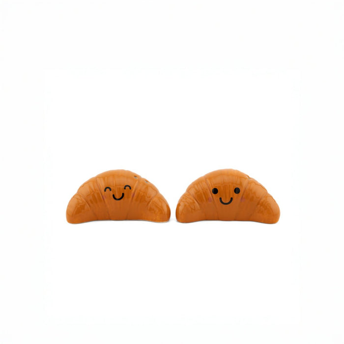 Sass & Belle Croissant salt and pepper shakers, front view with smiling faces