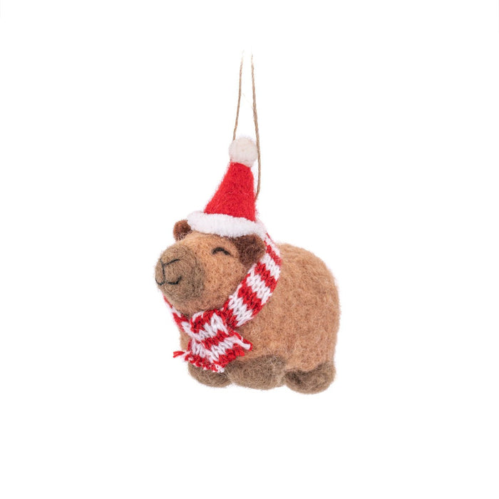 Sass & Belle felt capybara Christmas tree decoration wearing a Santa hat and red-white scarf, hanging by a loop
