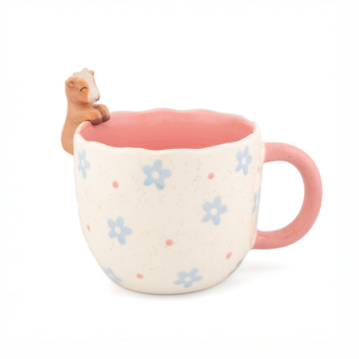 Coral Peeking Goat Mug shown in a bright lifestyle scene with flowers and matching ceramics