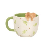 Back view of Sass & Belle Peeking Sloth Mug with green leaf pattern
