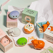 Sass & Belle Sausage Dog pocket token in gift box with other pocket tokens on a pastel background
