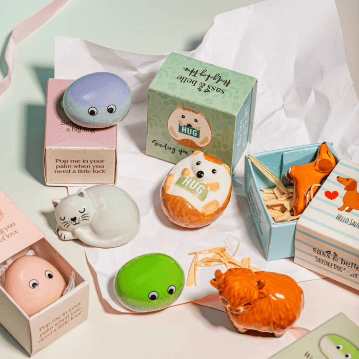 Sass & Belle Sausage Dog pocket token in gift box with other pocket tokens on a pastel background
