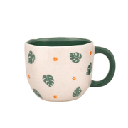Front view of the Sass and Belle Surprise Tiger mug with green leaf print, orange flower details and dark green handle