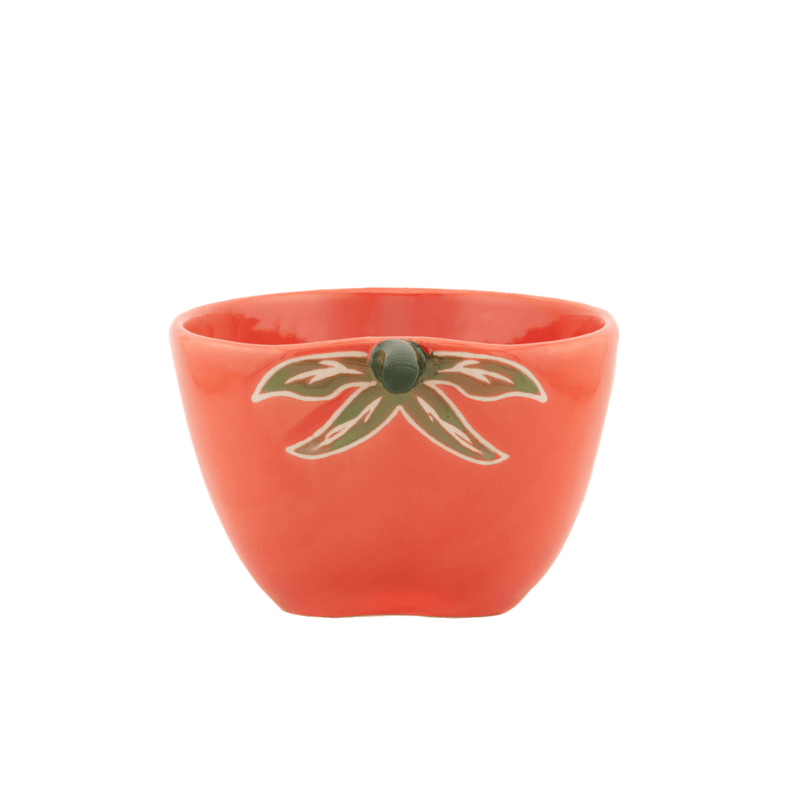 Front view of a Sass and Belle tomato measuring cup with orange ceramic finish and green leaf design