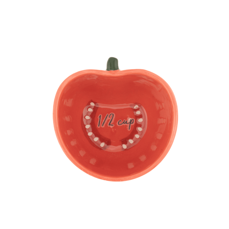 Sass and Belle tomato measuring cup showing the half cup measurement inside the ceramic tomato shaped cup