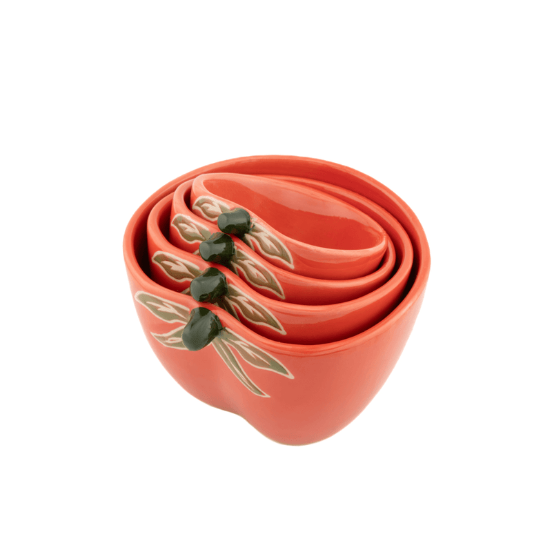 Nested Sass and Belle tomato measuring cups in orange stoneware with green tomato leaf details