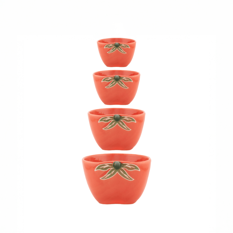 Sass and Belle tomato measuring cups shown stacked in four sizes with rustic tomato shape and leaf detail