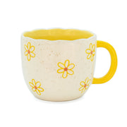 Side profile of Sass & Belle Highland Cow Daisy Mug featuring cream exterior with daisy prints and yellow handle

