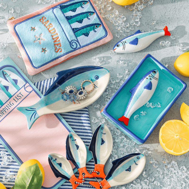 Sass & Belle sardine salt and pepper shaker displayed with coordinating fish accessories
