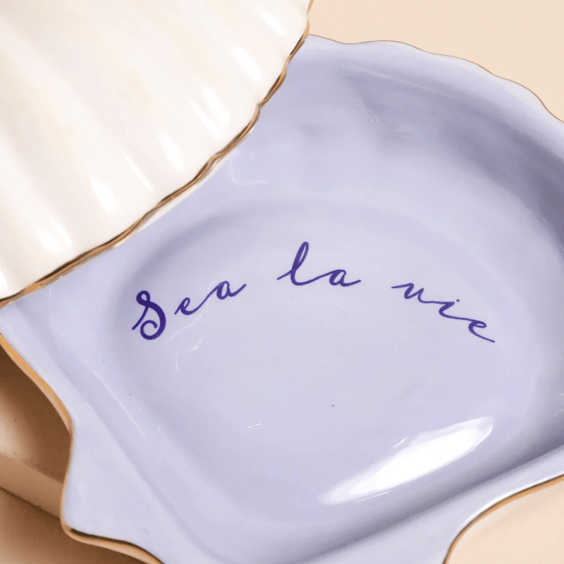 Close up of Sea La Vie message inside blue ceramic shell jewellery dish