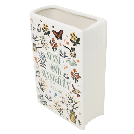 Angled top view showing sculpted pages and wide opening of the ceramic book vase.