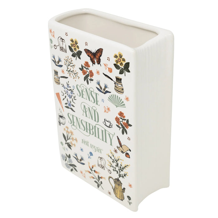 Angled top view showing sculpted pages and wide opening of the ceramic book vase.