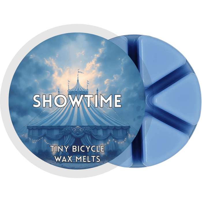Showtime wax melt label with blue circus tent; lemon top, vanilla heart and amber base home fragrance wax melts