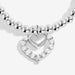 Close-up of Joma Jewellery heart halo charm with crystal-style stones on a silver-plated beaded Bracelet.