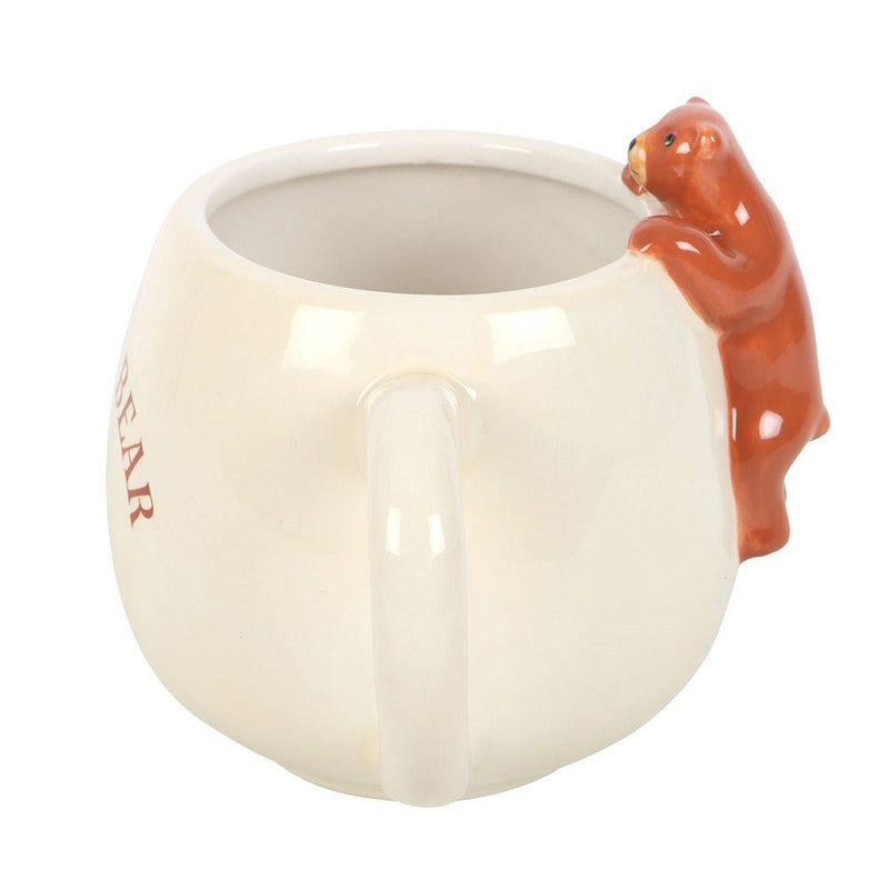 Side profile of Sleepy Bear mug highlighting handle and climbing bear detail.
