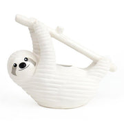 White ceramic sloth chia planter hanging from a branch on a plain white background