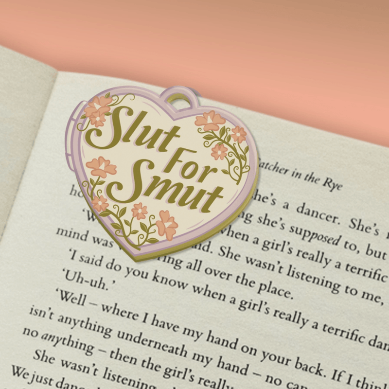 Slut For Smut magnetic bookmark marking a page in a book