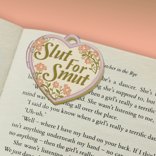 Slut For Smut magnetic bookmark marking a page in a book