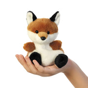 Sly Fox Palm Pals plushie sitting in a hand, showing its handy 13 cm size
