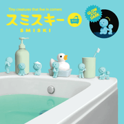 Blue Smiski Bath Series glow-in-the-dark figures displayed around a bathroom and bath