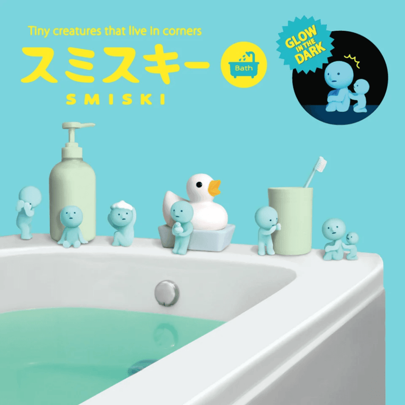 Blue Smiski Bath Series glow-in-the-dark figures displayed around a bathroom and bath
