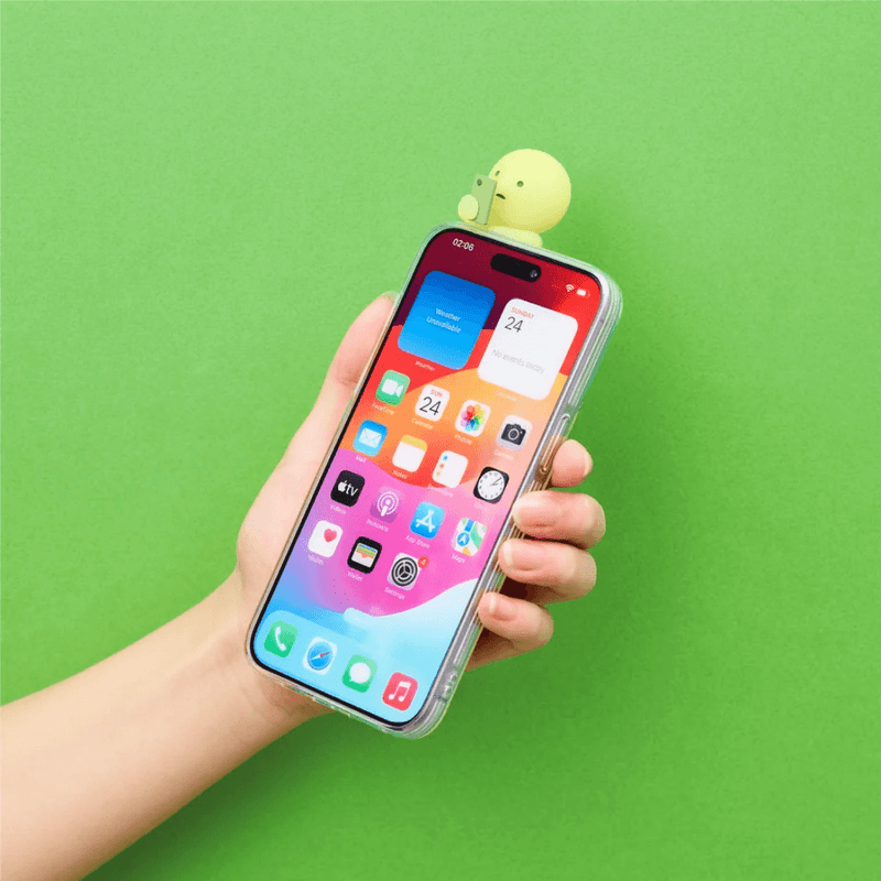 Smiski Hipper attached to a smartphone case held in a hand