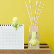 Smiski Hippers decorating a desk calendar and reed diffuser